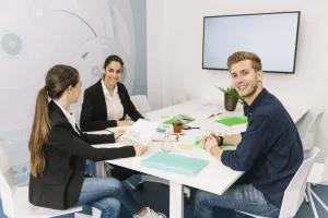 group smiling young businesspeople workplace