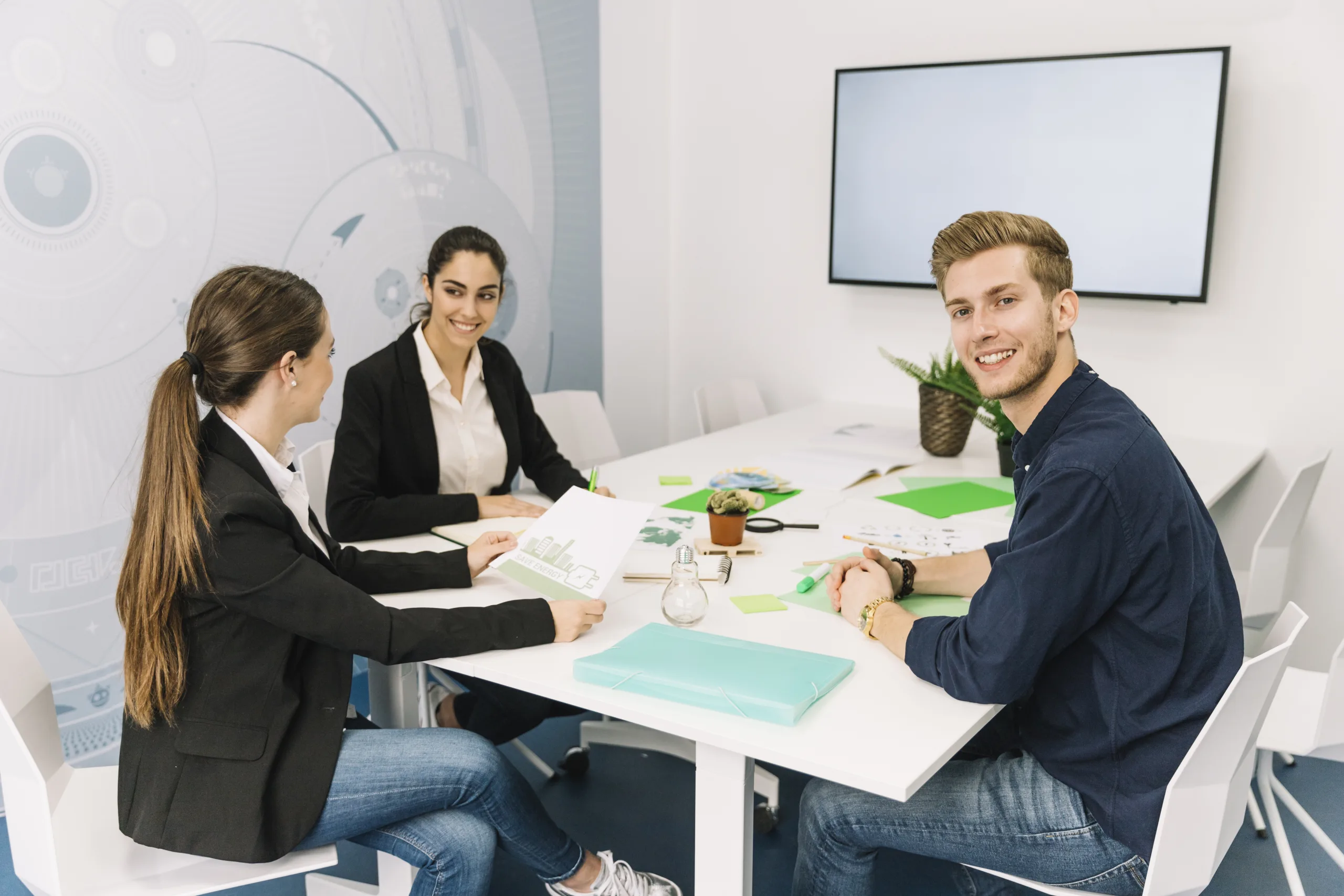 group smiling young businesspeople workplace